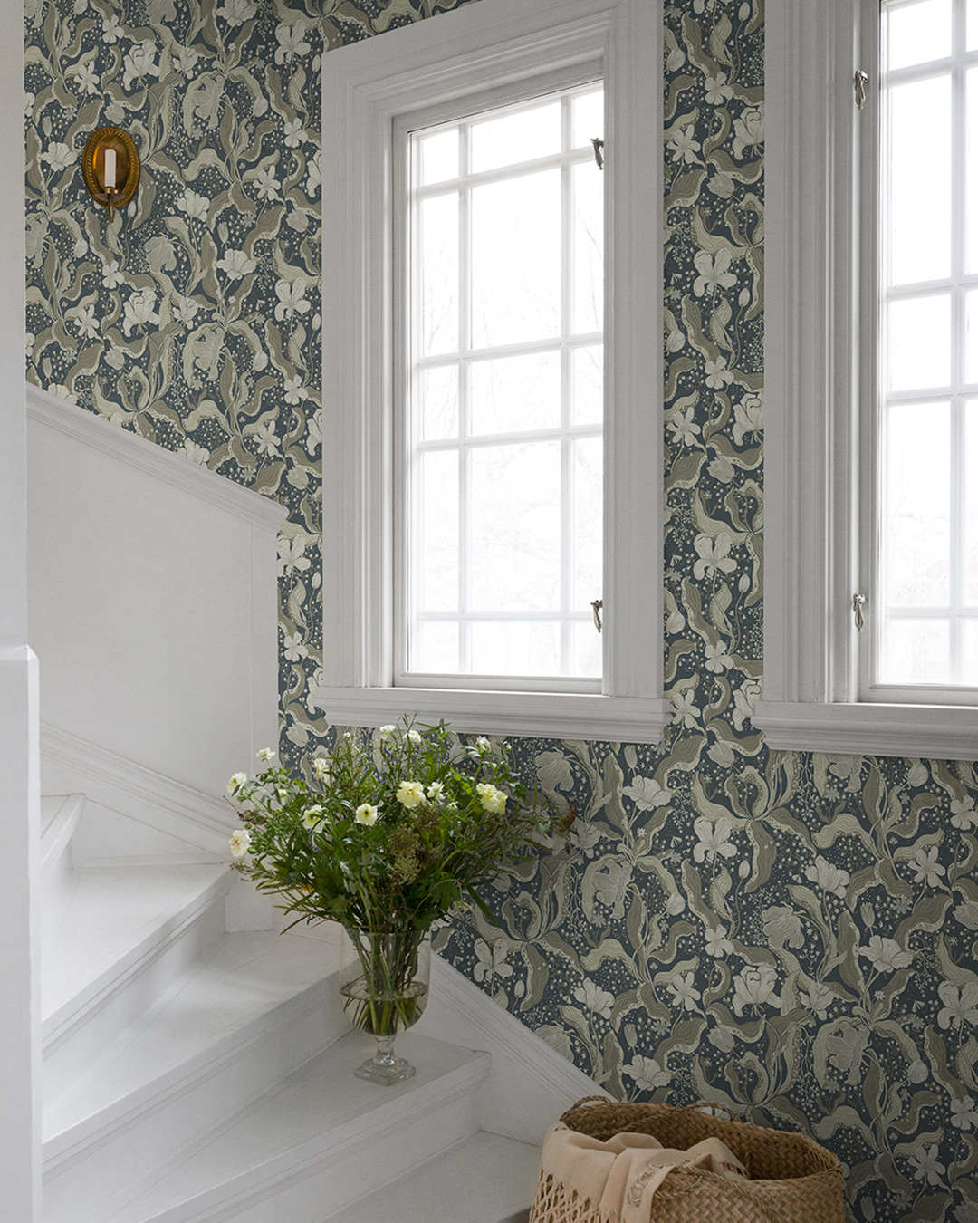 White staircase with floral wallpaper
