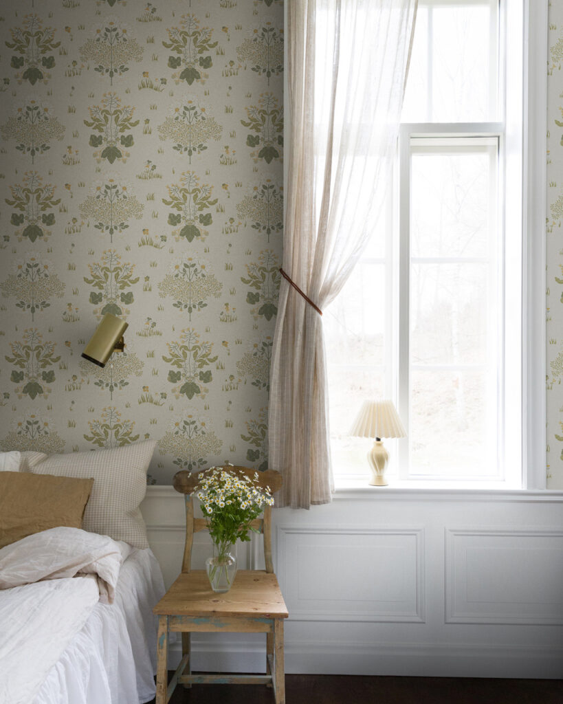 Rustic bedroom wallpaper featuring country flowers, sheer curtains, and a white wainscot
