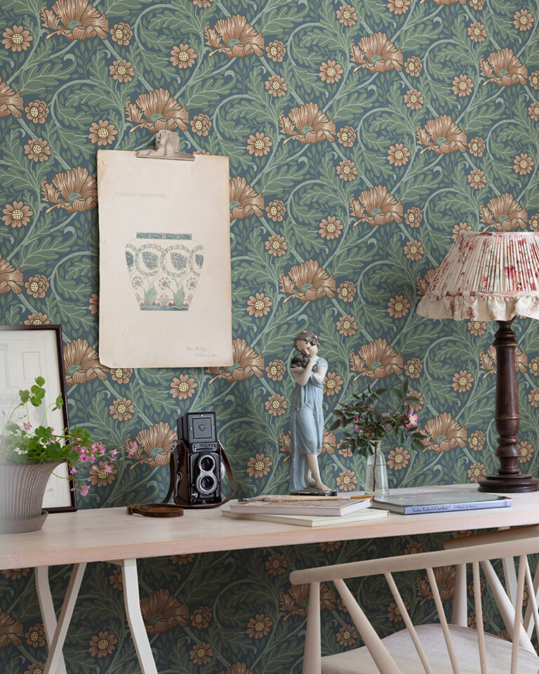 Wallpaper with a dark blue background, featuring detailed green foliage and pink-red flowers