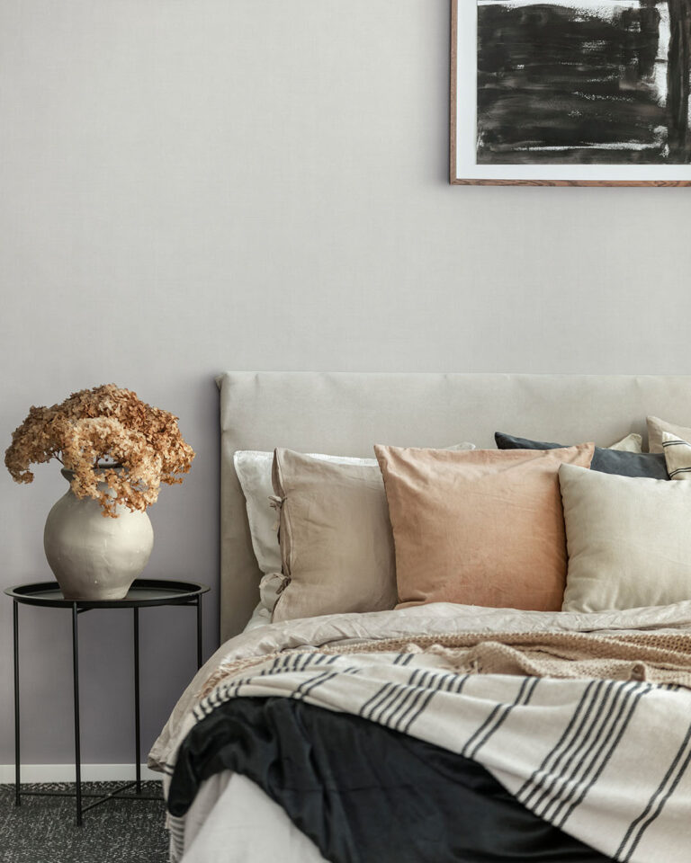 white / light gray solid-color wallpaper in the bedroom