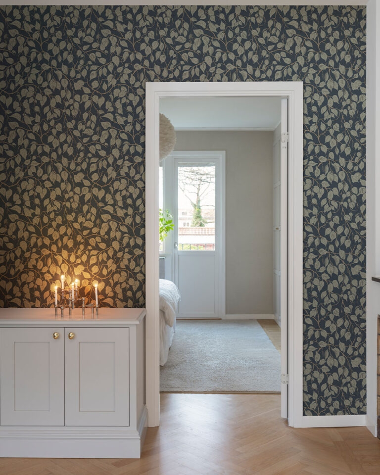 Wallpaper with a dark blue background and green leaves in a hallway
