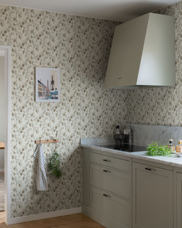 Bright kitchen with a pine forest motif on the wallpaper