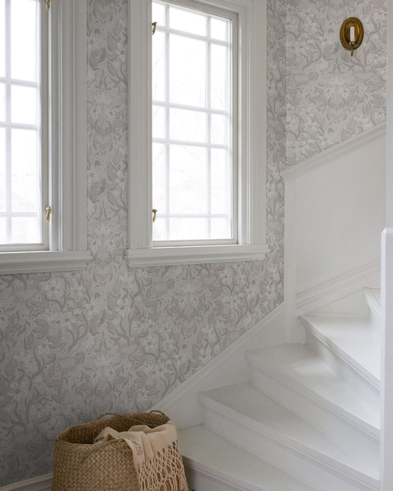 Hall inspiration with gray-beige wallpaper and a white staircase