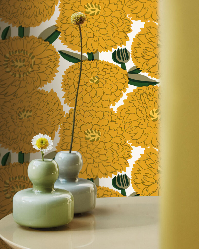 A room with wallpaper featuring large yellow flowers from Marimekko