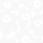 White wallpaper with a floral, retro pattern