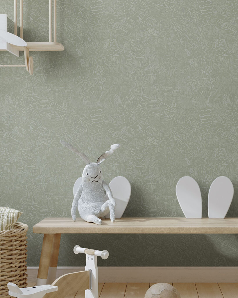 green wallpaper with cartoon forest motifs in a child's room, featuring a stuffed animal on a bench
