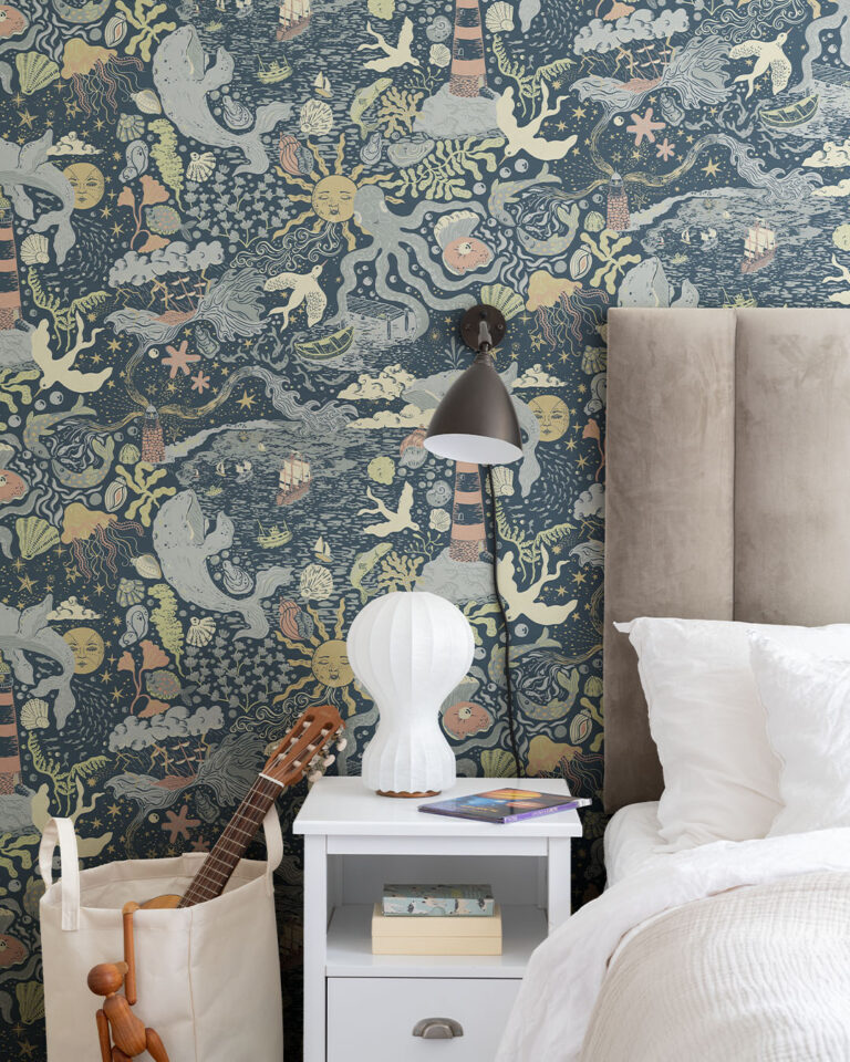 children's room with lovely blue wallpaper featuring a seaside motif