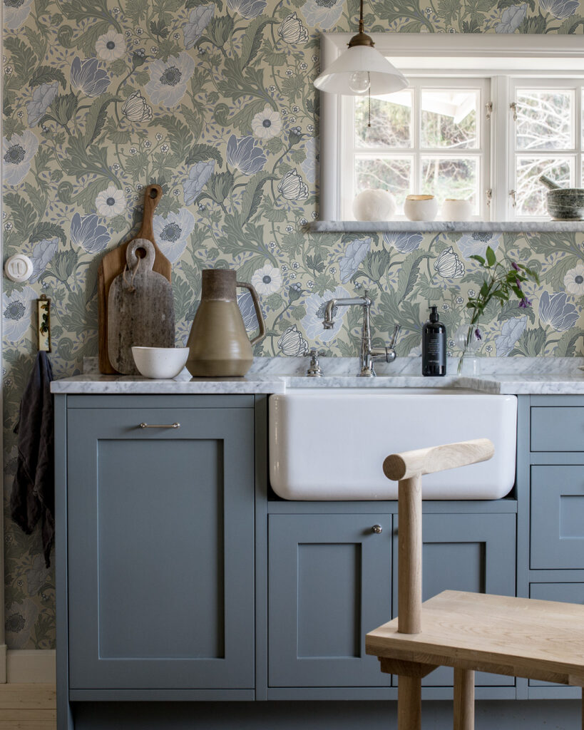 Beige wallpaper with flowers and leaves in shades of blue-purple and green in a kitchen