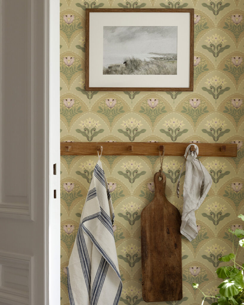 Beige floral trellis wallpaper in a kitchen behind a painting