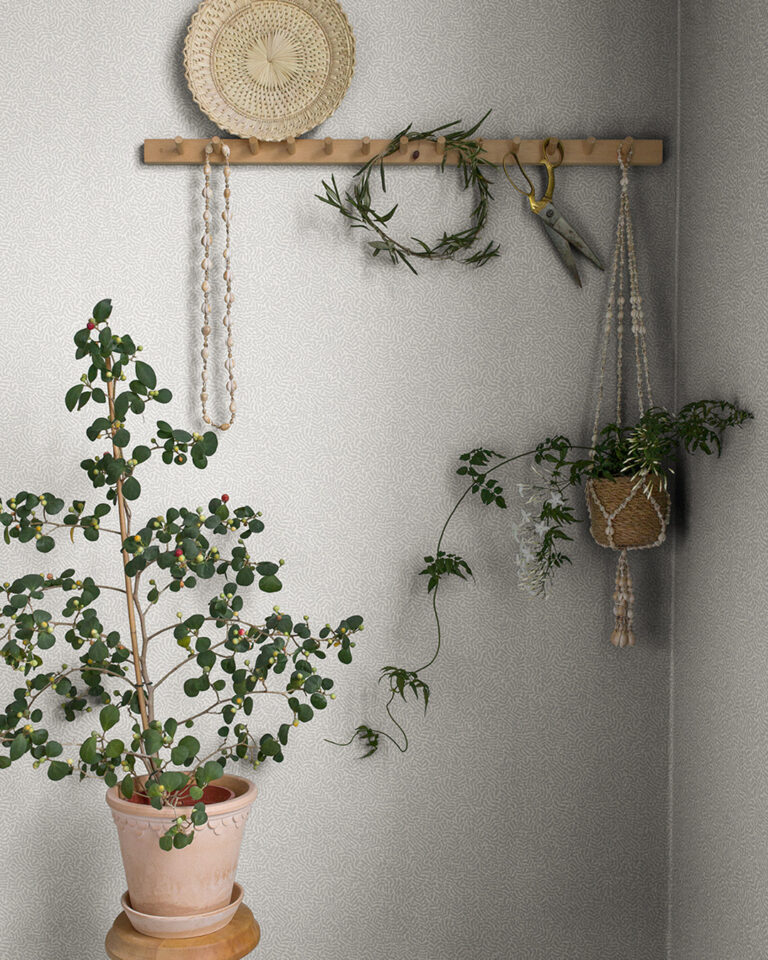 Light gray wallpaper with a subtle leaf pattern.