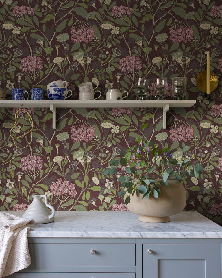 Floral wallpaper with purple accents in a gray-blue kitchen