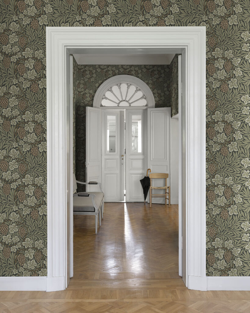 dark green wallpaper with grapes in a turn-of-the-century hallway