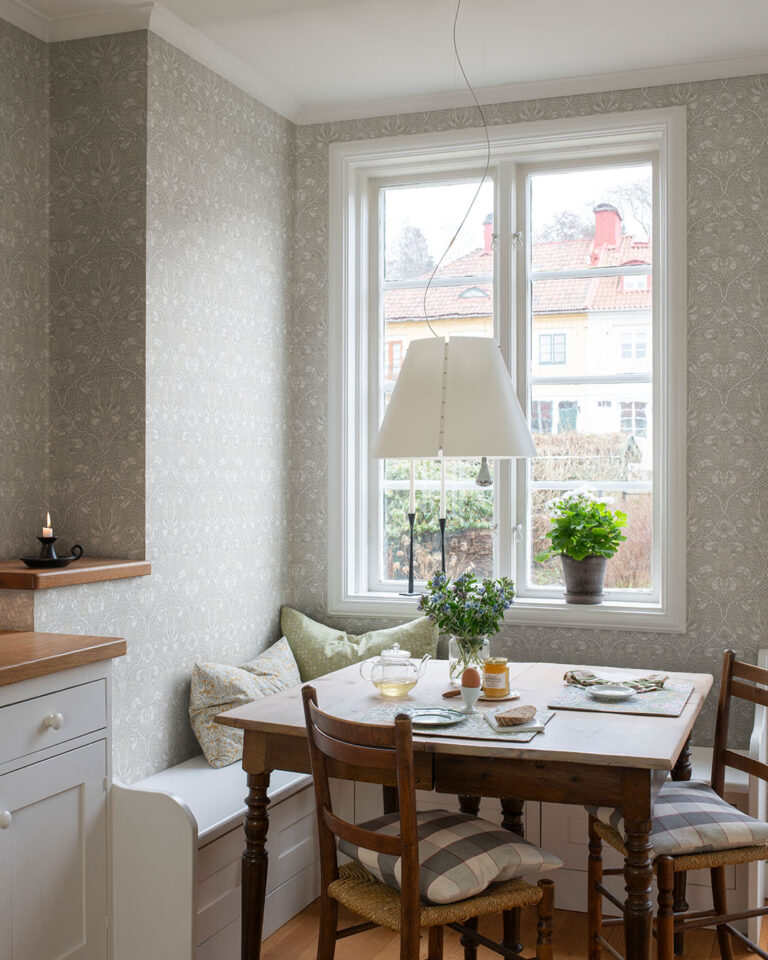 kitchen with light gray wallpaper and old-fashioned furniture